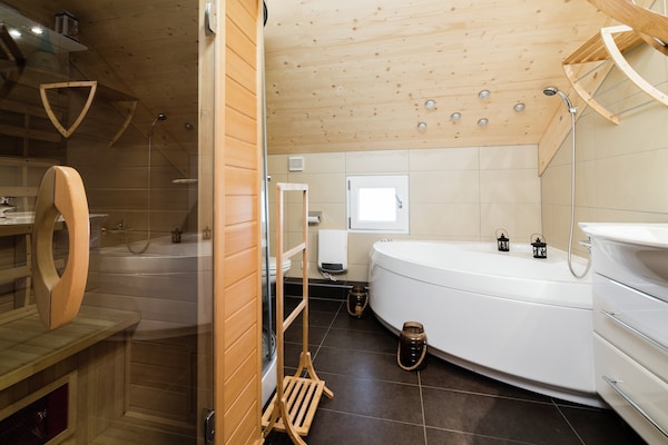 Foto van Sfeervol chalet met hottub - Vakantiehuis in Sankt Georgen am Kresichberg - BathRoom