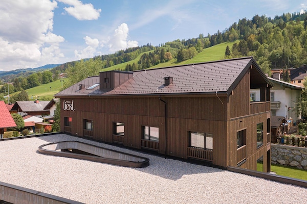 Foto van Premium vakantieappartement met sauna en tuin - Vakantiehuis in Haus im Ennstal - ExteriorSummer