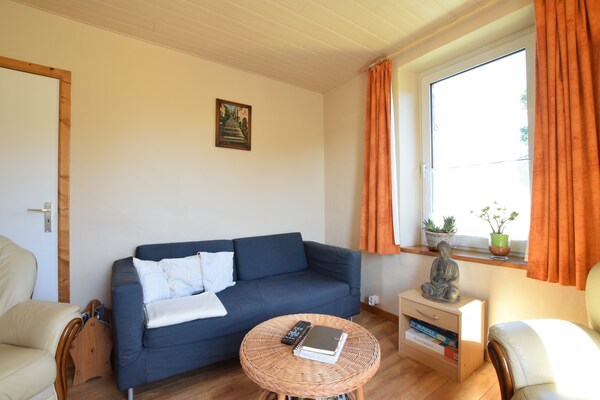 Foto van Chalet in Bovigny met bos en barbecue - Vakantiehuis in bovigny - LivingRoom