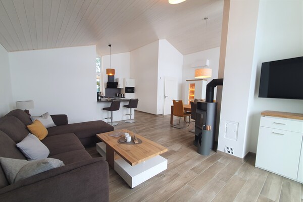 Foto van Vakantiehuis met sauna in vakantiepark Mirow - Vakantiehuis in Granzow - LivingRoom