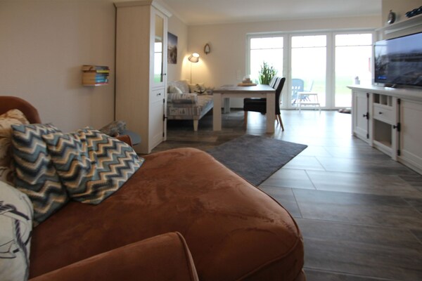 Foto van Vakantiehuis met tuin - Vakantiehuis in Neßmersiel - LivingRoom