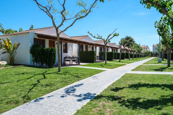 Foto van Tropische bungalow met terras - Vakantiehuis in Tarragona - ExteriorSummer