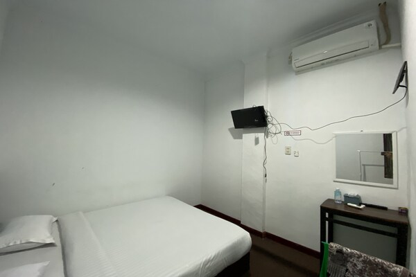 Foto van Quanza Hotel • Heritage Double - Vakantiehuis in Banda Aceh - BedRoom