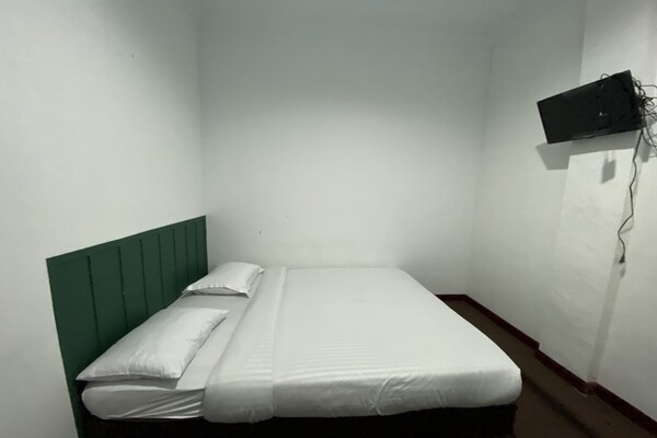 Foto van Quanza Hotel • Heritage Double - Vakantiehuis in Banda Aceh - BedRoom