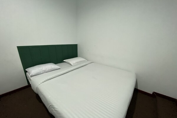 Foto van Quanza Hotel • Heritage Double - Vakantiehuis in Banda Aceh - BedRoom