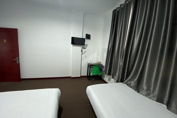 Foto van Quanza Hotel • Heritage Familiesuite - Vakantiehuis in Banda Aceh - BedRoom