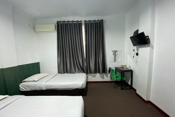 Foto van Quanza Hotel • Heritage Familiesuite - Vakantiehuis in Banda Aceh - BedRoom