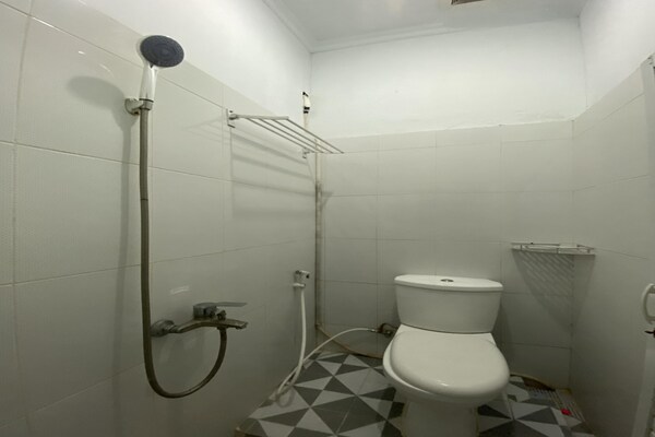 Foto van Quanza Hotel • Heritage Familiesuite - Vakantiehuis in Banda Aceh - BathRoom