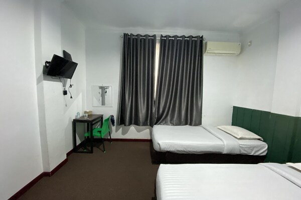 Foto van Quanza Hotel • Heritage Familiesuite - Vakantiehuis in Banda Aceh - BedRoom