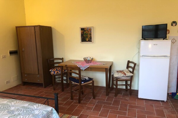 Foto van Boerderij in Paciano met Zwembad & Uitzicht - Vakantiehuis in Paciano - LivingRoom