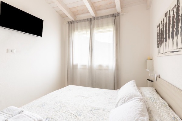 Foto van Zolder met terrazza en zwembad condivisa - Vakantiehuis in Badesi - BedRoom