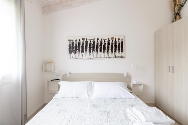 Foto van Zolder met terrazza en zwembad condivisa - Vakantiehuis in Badesi - BedRoom