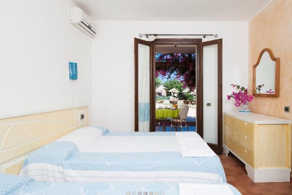 Foto van Tweekamerappartement in een complex - Vakantiehuis in Villasimius - BedRoom