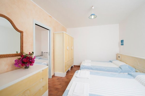 Foto van Tweekamerappartement in een complex - Vakantiehuis in Villasimius - BedRoom