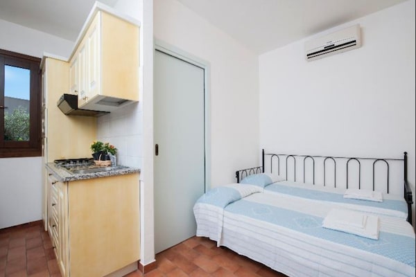 Foto van Tweekamerappartement in een complex - Vakantiehuis in Villasimius - BedRoom