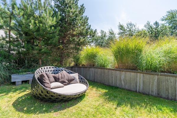 Foto van Sfeervolle 8 persoons villa met hottub bij bos - Vakantiehuis in De Koog - GardenSummer