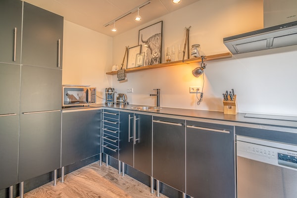Foto van Sfeervolle 2-persoons vakantiewoning - Vakantiehuis in De Koog - Kitchen