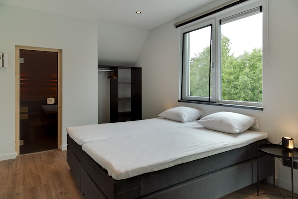 Foto van Bungalow op Texel bij duinenpark - Vakantiehuis in De Koog Texel - BedRoom