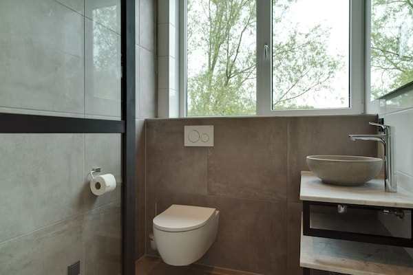 Foto van Bungalow op Texel bij duinenpark - Vakantiehuis in De Koog Texel - BathRoom