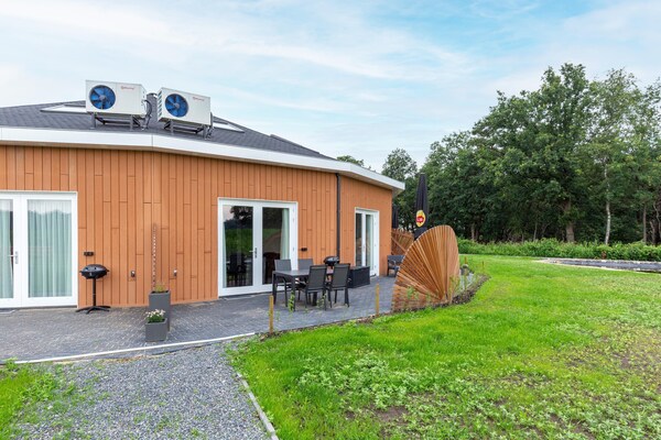 Foto van Vakantiehuis in bosrijke omgeving met terras - Vakantiehuis in Goirle - ExteriorSummer