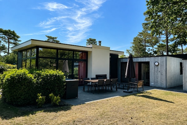 Foto van Relaxed Woodland Chalet voor 6 personen - Vakantiehuis in Otterlo - ExteriorSummer