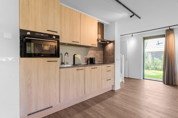 Foto van Vrijstaande bosvilla voor 6 personen, wandel-/fietsroute in Lochem. - Kitchen