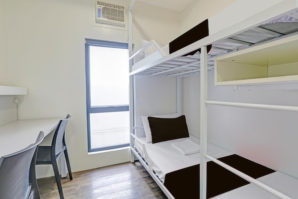 Foto van Trendy gemengd slaapverblijf voor Makati Nights - Vakantiehuis in Makati City - BedRoom