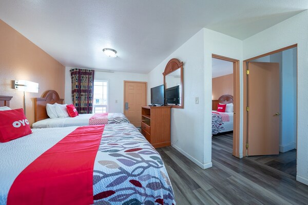 Foto van Premium kamer met 2 queensize bedden en kitchenette. - BedRoom