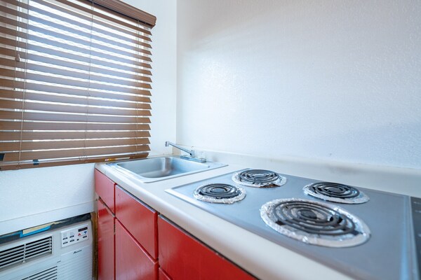 Foto van Premium kamer met 2 queensize bedden en kitchenette. - BedRoom
