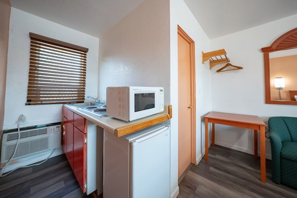 Foto van Premium kamer met 2 queensize bedden en kitchenette. - BedRoom