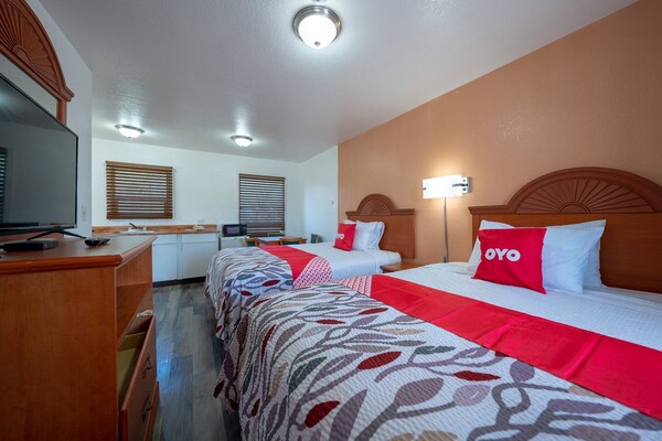 Foto van Premium kamer met 2 queensize bedden en kitchenette. - BedRoom