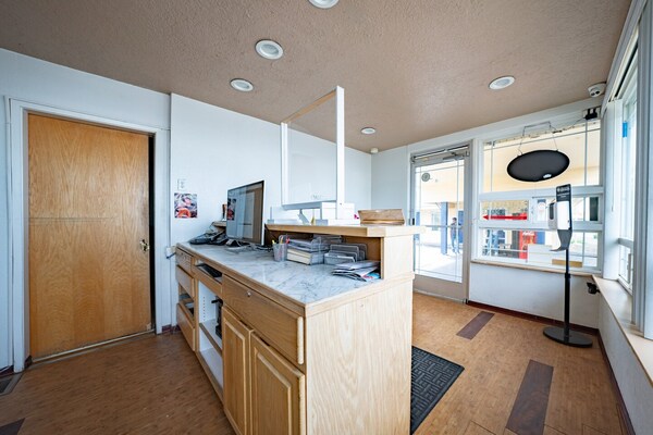 Foto van Premium kamer met 2 queensize bedden en kitchenette. - HallReception
