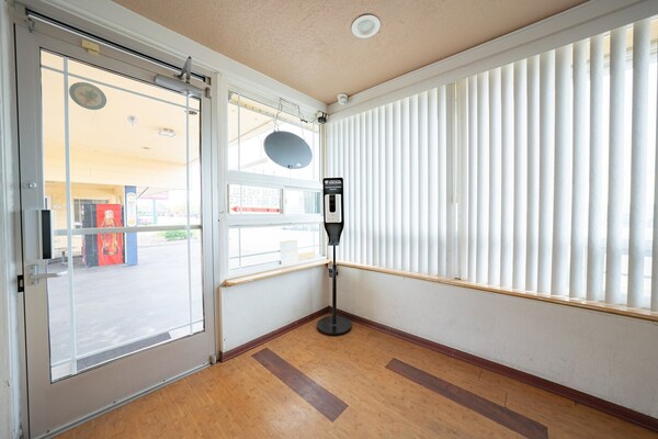 Foto van Premium kamer met 2 queensize bedden en kitchenette. - HallReception