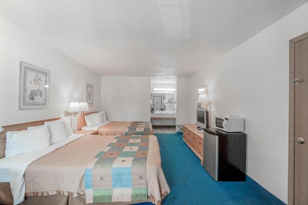 Foto van Luxe kamer met 2 queensize bedden en balkon - Vakantiehuis in Eureka Springs - BedRoom