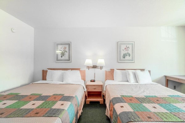 Foto van Luxe kamer met 2 queensize bedden en balkon - Vakantiehuis in Eureka Springs - BedRoom